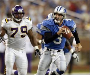 Detroit quarterback Joey Harrington, right, is forced to scramble as Minnesota defensive end Kenny Mixon gives chase. 