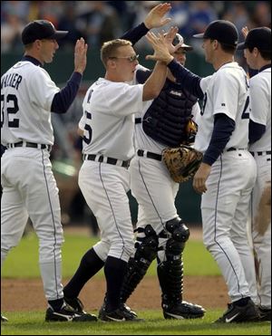 From left, Tigers Jamie Walker, Brandon Inge, Matt Walbeck and A.J. Hinch celebrate a victory that prevented 120 losses but still capped a dismal season in Detroit.