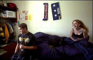 Mike McVetta, 19, and Vicki Beckett, 18, in Mr. McVetta's sparsely decorated room in The Crossings residence hall at the University of Toledo.

