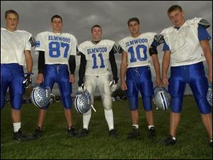 Elmwood quarterback Kyle Rhoad (11) can pass to an array of standout receivers in, from left, Chad Reynolds, Eric Wansitler, Brian Berry and Adam Blachuta.