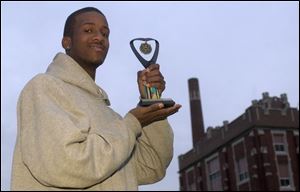 Jeremy Crawford won a trophy in a poetry contest, a feat that goes hand-in-hand with his rapping ability.