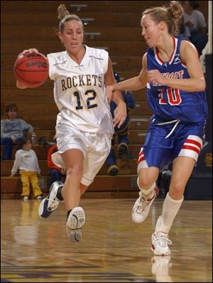 Toledo's Mary Blessing tries to dribble past Detroit's Caitie Goddard on a fast break at Savage Hall. Blessing had nine points in a game marred by 54 turnovers.