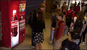 The Toledo schools have a 10-year contract to put Coca-Cola machines in their buildings.