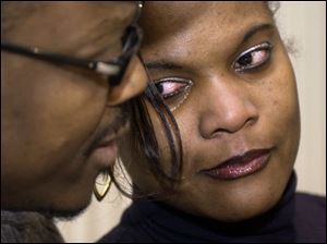 Elecia Battle and her husband, Jim, during yesterday's press conference.