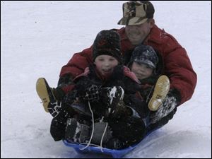 Cty At ottawa park MIchael Day,6, Eric Day 3 Father Steve day of toledo.  blade photo  by herral long 1/17/2004