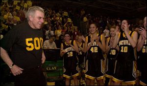 Northview s Jerry Sigler wears a smile and a shirt to proclaim his 500th victory. He is just the fourth coach in Ohio girls basketball history to do so. List on Page 8.