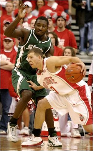 Tony Stockman drives around Michigan State s Kelvin Torbert. He leads Ohio State in scoring at 13.3 points per game.