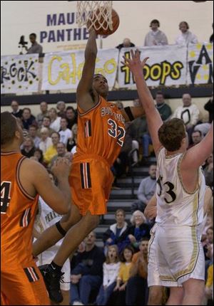 Southview s Jamar Murchison goes up for two of his game-high 21 points. The Cougars need just one win in their final three games to clinch a share of the NLL title.