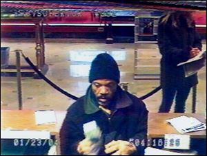 The suspect in a robbery of the KeyBank on North Superior Street in Toledo is captured on the bank s surveillance camera. The robbery occurred Jan. 23.
