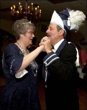 NBR mardi21p -  Kris Abel and Bob Richards share a dance with one another on Saturday, Feb. 21, 2004 at the Mardi Gras party held at Oak Shade Grove in Oregon. The two were named the Mardi Gras Prince and Princess for 2004 at the event put on by the American Turners.(The Blade/Jason Braverman)