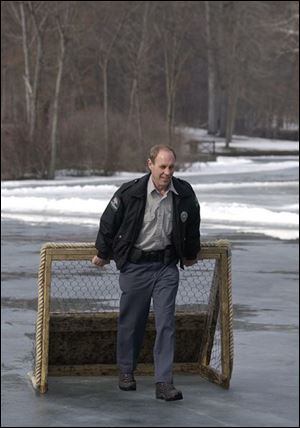  This seemed like a good time to wrap things up,  says longtime Metroparks Ranger Jerry Jankowski, dragging a hockey goal off Mallard Lake one last time.