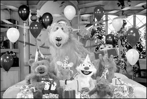 Tutter the mouse enjoys the surprise party given to him by, clockwise from left, Ojo, Bear, Pip, Pop, and Treelo.