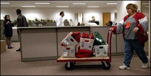 A worker delivers ballots to the Lucas County Board of Elections at Government Center in downtown Toledo.