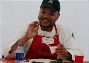 Chef William Richardson of Poco Piatti approves of an entry during last year's cook-off.
