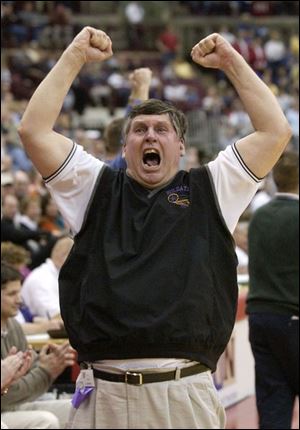 Holgate coach Paul Wayne celebrates the first state crown in school history as the Tigers beat Marion Local.