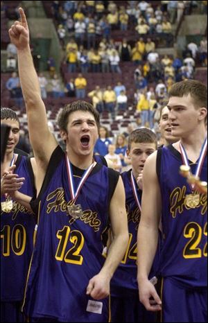 Ryan Fruth, left, proclaims Holgate's lofty position in the state while teammate Lee Brubaker takes the title in stride.