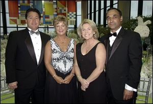 DRESSED FOR CLASS: David and Linda Ball, left, and Annette and Mike Moriarty look elegant.