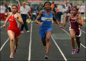 Libbey sophomore Danyelle McGary, center, swept the girls sprint events in the City League track championships last night at Start.