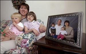 Linda Ollerenshaw, with daughters, Clara and Anna, and an earlier family portrait.