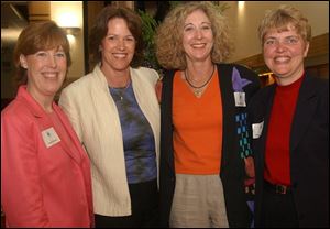 A NIGHT FOR CLAIRE: From left, Susan Morgan, Christine Brennan, Sandra Hylant, and Pam Hershberger pal it up at the library's main branch downtown.