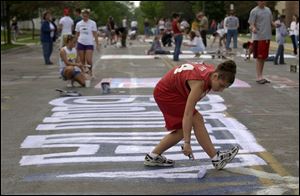 Brittant Rogerswas among the Bluffton seniors painting a street under supervision.