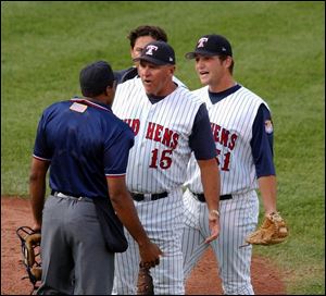 Manager Larry Parrish (15) has the Mud Hens playing hard, as evidenced by 15 come-from-behind victories. By JOHN WAGNER