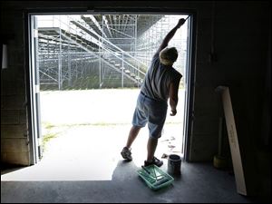 ROV regionpaint 01 - Dean Taft does some routine mainatinance at the Bowling Green fairgrounds in preparation for the upcoming Wood County Fair which starts August 2. Allan Detrich/The Blade