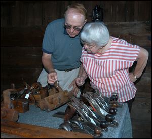 Nbr Photo by Don Simmons July 23, 2004   L to R  Jack Devitt who has tools  on diplay at the 56Barailey Depot on county rd 3   checks the price of one of them for Vera Stever of Delta Ohio  ( tool23p )