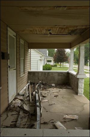 The front porch of the abandoned house.