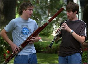 James Basel, 15, plays the bassoon and his brother Joe Basel, 16, the oboe in a practice session for the Ohio State Fair band.