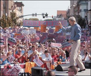 Sen. John Kerry works up the crowd, estimated between 12,000 to 15,000, in Bowling Green during his visit on Sunday with running mate Sen. John Edwards.
