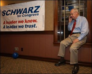 Joe Schwarz talks on the phone to Sen. John McCain (R., Ariz.) the morning after Mr. Schwarz won the Michigan GOP primary for the 7th Congressional District.