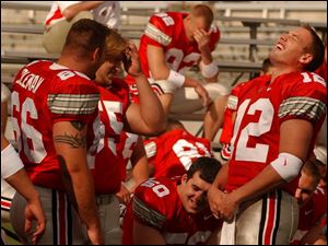 Ohio State quarterback Justin Zwick (12) and his teammates enjoy media day at Ohio Stadium.