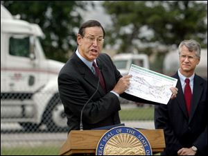 Gov. Bob Taft unveils a proposal to lure semi drivers to the Ohio Turnpike by raising the truck speed limit to 65 mph and lowering the tolls that drivers of big rigs have to pay.