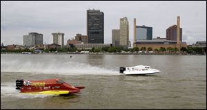 Jason Campbell, right, and Bill Rucker shoot up spray in practice for the Maumee River Roar.