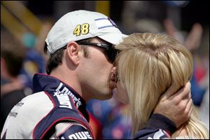 Fiancee Chandra Janway kisses Jimmie Johnson, who kissed his points lead good-bye when be blew an engine at MIS.