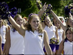 CTY August 21, 2004 - Maumee High School cheerleaders, including Lauren O'Brien, 16, center, cheer while marching in the Maumee Summer Fair parade.  Blade photo by Dave Zapotosky