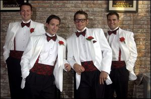 The Repertoires - Jared Dorotiak, left, Rob Hall, Zach Lahey, and Justin Reid - performed at a benefit dinner for the Toledo Rep at Manhattan's.