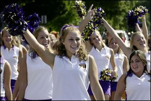 CTY August 21, 2004 - Maumee High School cheerleaders, including Lauren O'Brien, 16, center, cheer while marching in the Maumee Summer Fair parade.  Blade photo by Dave Zapotosky