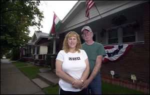 Sherry Shabnow and her fiance, Dave Yates, show off their rehabilitated home at 320 Burger St. in the Birmingham district.