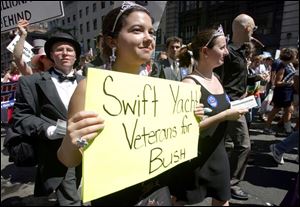 Lisa Wilson, who belongs to the sarcastically named Billionaires for Bush, marches down New York City's Fifth Avenue with a group of protesters.