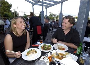 CHOPSTIXX: Traci Sands and Dave Parrish eat Asian al fresco on the patio at Stixx Asia Bistro on Monroe Street in Sylvania.