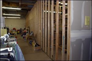 Volunteers are renovating a former grocery store that is used for Open Door's thrift shop.