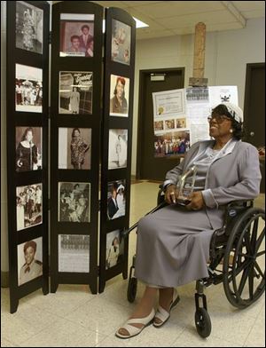  
Award winner Charlotte Ransom Starnes looks over her photos during her entertainment days.