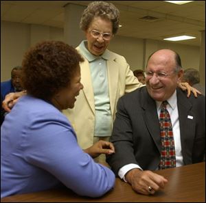 Mary J. Davenport, center, nominated Ed Reiter, who laughs with Pat Sloan, recreation director.         