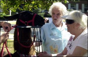 NBR grand11p 04 09/11/04 - Residents Martha Pym, left, reacts to 