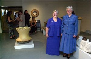 Mary Gilson, left, and Sharon Weber attend the Art Gala fund-raiser at Flatlanders.