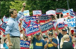 Candidate John Edwards appears encouraged after delivering a stump speech in Portsmouth, Ohio, yesterday. Edwards pledges to keep jobs of workers at uranium plant