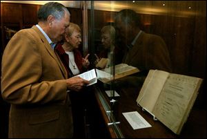 POINT OF LAW: Harold and Carolyne Kelley discuss a book on exhibit at the downtown library.