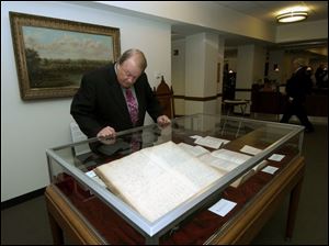 READING THE LAW: Judge Bill Skow checks out what's on the books at the exhibit or rare books.